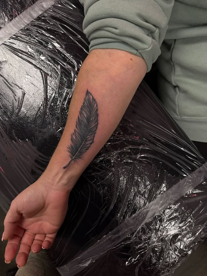 Feather forearm cover up in black & grey realism