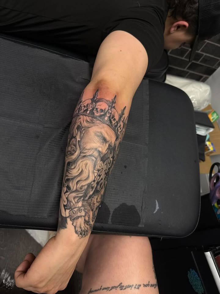 King with crown and skulls — black & grey forearm sleeve