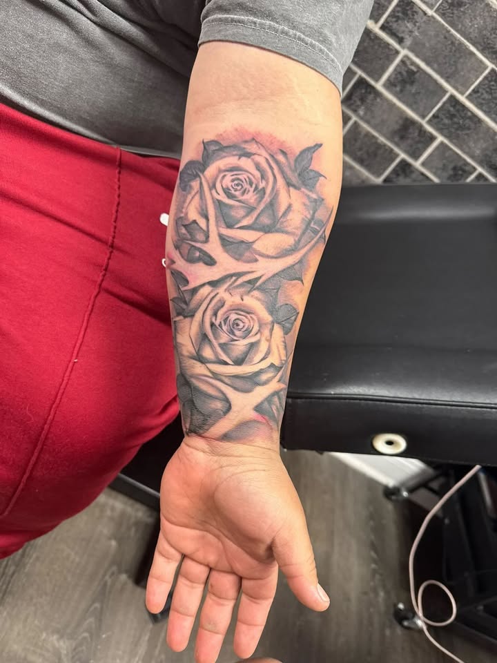 Stacked roses forearm piece in black & grey realism